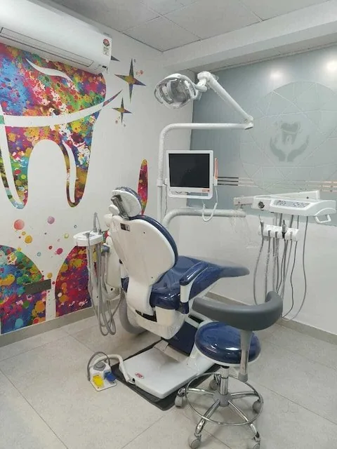 Treatment room at Imperial Dental with dental chair and colourful tooth artwork