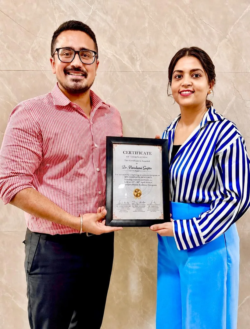 Dr. Vandana Gupta receiving her certificate of completion for the BPS Complete Dentures programme at Gurjar's Dental Academy, Gurugram
