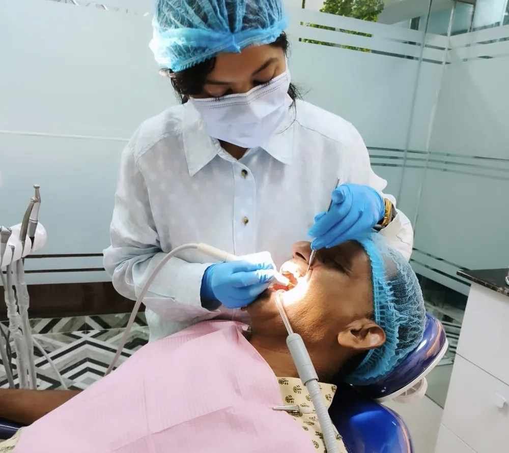 Dr. Vandana Gupta carrying out a careful dental treatment at Imperial Dental, Mayur Vihar
